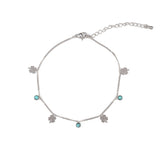 Нежна гривна за глезен с детелини и тюркоазени мъниста, символизираща късмет и хармония.