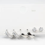 Комплект обици сребристо, включващ две двойки обеци и кристални декорации.