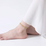 Двойна гривна за глезен с цветни камъчета, идеална за лятото и специални поводи.