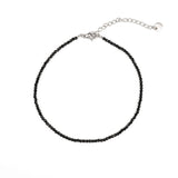 Гривна за глезен с черни мъниста и сребриста закопчалка, универсален аксесоар за стил и настроение.