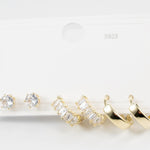 Комплект обеци с две златисти и сребристо камъни, идеални за три пиърсинг дупки, във водоустойчива медицинска стомана.