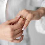 Woman wearing Lyna ring with 18K gold plating, showcasing a modern and elegant style.