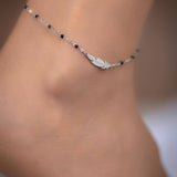 Ασημένια αλυσίδα αστραγάλου φτερό με μαύρες χάντρες