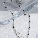 Ασημένια αλυσίδα αστραγάλου φτερό με μαύρες χάντρες