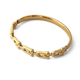 Твърда златиста гривна Signature, изработена от медицинска стомана, елегантен и минималистичен дизайн.